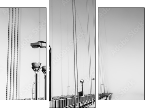 Fog over  Golden Gate Bridge. San Francisco. Part of the famous Golden Gate Bridge. The ocean coast near San Francisco, California. Black and white. - Dreiteiliges Leinwandbild, Triptychon
