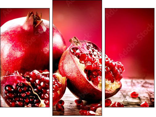 Pomegranates over Red Background. Organic Bio fruits - Dreiteiliges Leinwandbild, Triptychon
