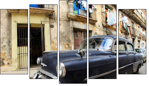 A classic old car is black color parked in front of the building - Fünfteiliges Leinwandbild, Pentaptychon