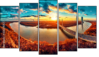 Beautiful panoramic aerial drone view to cable-stayed Siekierkowski Bridge over the Vistula river and Warsaw City skyscrapers, Poland in gold red autumn colors in November evening at sunset - Fünfteiliges Leinwandbild, Pentaptychon